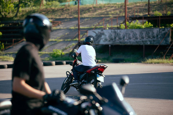 Moto school track driving. A biker on a motorcycle. - Fotó, kép