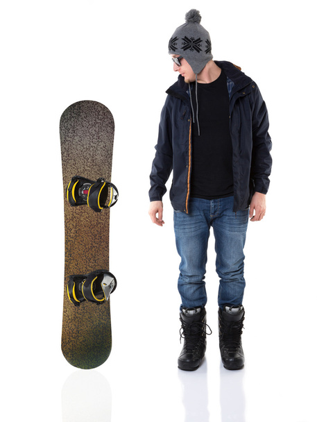 Young man and snowboard - Foto, imagen