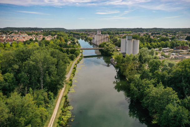 aerial view on the river the loing and the Charles Hochart bridge on the city of Nemours in Seine et Marne in France - Photo, image