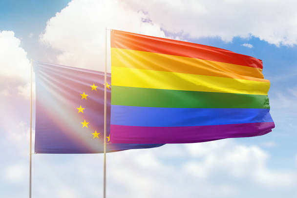 Sunny blue sky and flags of lgbt and european union - Foto, imagen