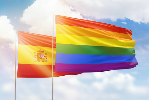 Sunny blue sky and flags of lgbt and spain - 写真・画像