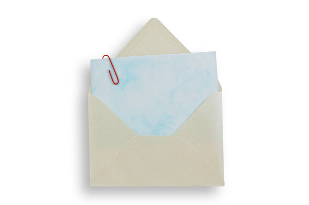 Open envelope wiht card inside, isolated white background, clipping path. - Foto, Bild