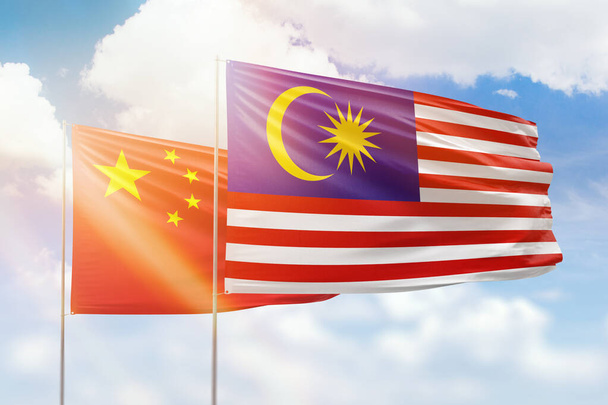 Sunny blue sky and flags of malaysia and china - Foto, Imagem