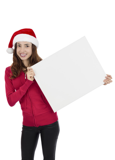 Mulher de Natal atraente segurando uma placa de sinal em branco
 - Foto, Imagem