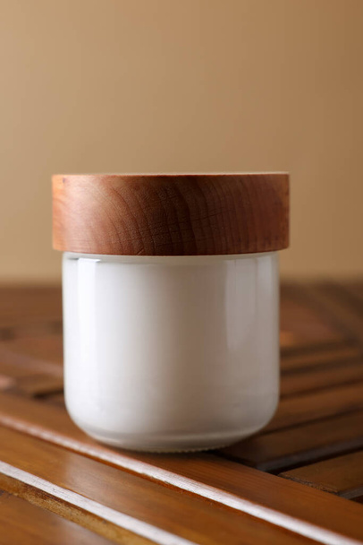 Jar of luxury cream on wooden table, closeup - Valokuva, kuva