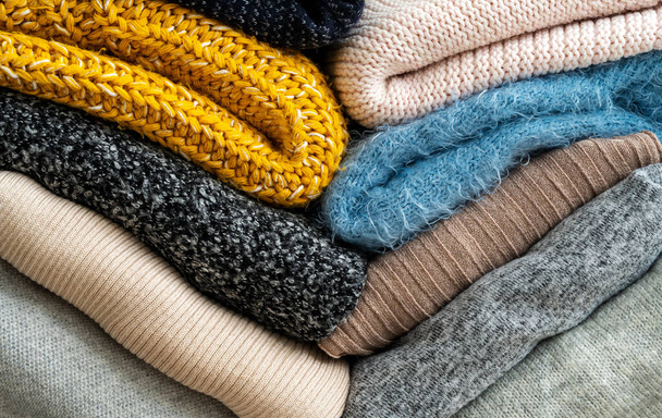 Stack of clothes with different colours and materials. - Photo, image