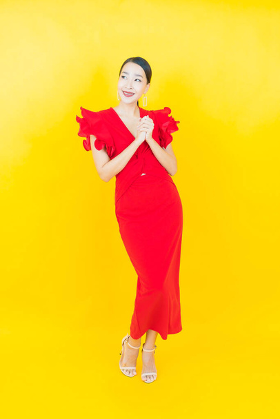 Portrait beautiful young asian woman smile with action on color background - Fotografie, Obrázek