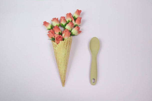 Beautiful flowers inside an ice cream cone - Fotoğraf, Görsel