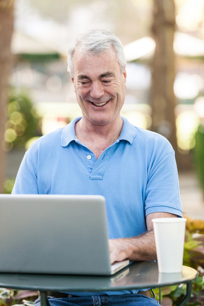 Senior Man with Computer at Park - Фото, зображення