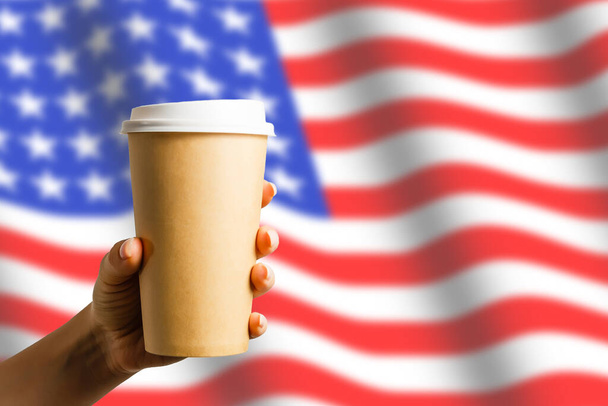 Closeup of American flag with coffee paper cup - Photo, Image