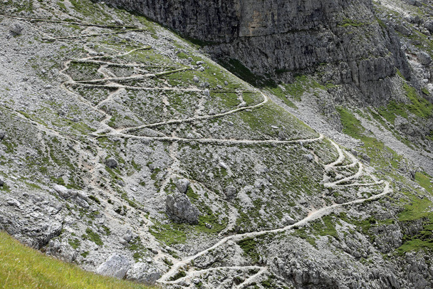 serpentine path in the Alps mountains with a zigzag pattern - Photo, Image