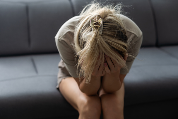 Depressed upset young woman feeling hurt sad stressed troubled with unwanted pregnancy, regret mistake abortion, having headache or drug addiction, suffer from grief dramatic bad problem concept - Foto, immagini