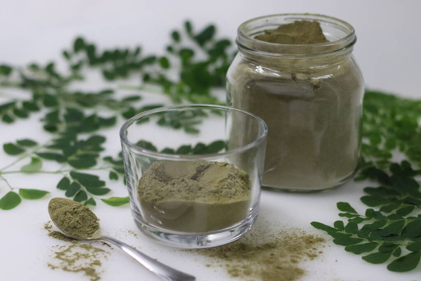 Dried moringa leaf powder. Powdered form of sun dried stemless drumstick leaves. Helps to add moringa leaves to food. Moringa leaves are nutritionally very rich and have high nutrition value. - Photo, Image