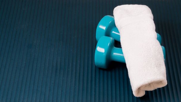 Dumbbells and Towel Sports Background Workout. High quality photo - Φωτογραφία, εικόνα
