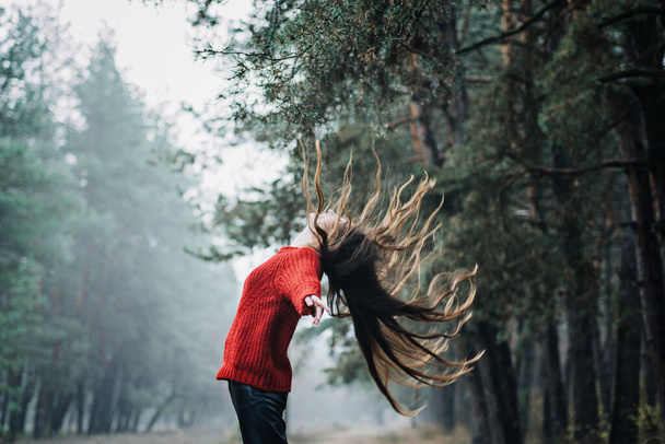 Nervous breakdown, mental breakdown. Exited woman with long fluttering hair express emotions on nature background - Foto, afbeelding