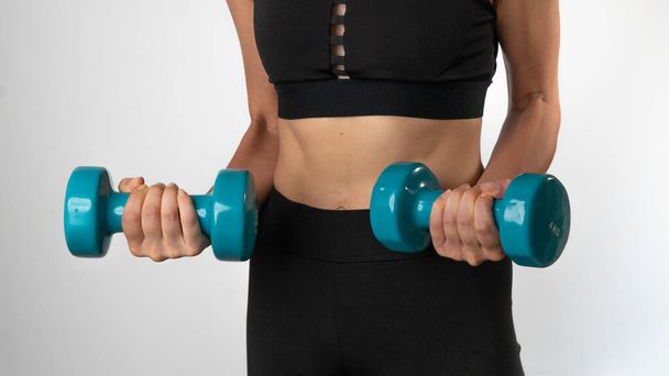 Home Workout Woman with Dumbbells - Sport. High quality photo - Photo, Image