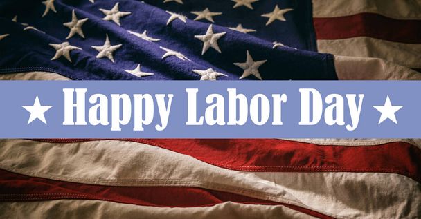 Happy Labor Day text on USA Flag background, close up view. National US America holiday celebration - Foto, imagen