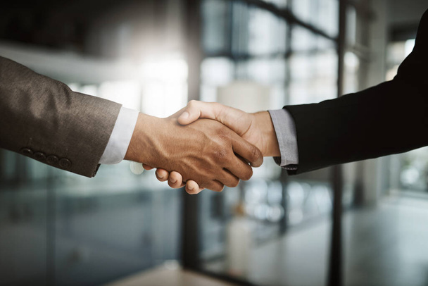 Handshake, collaboration and businessmen celebrating and congratulating on success for a sealed deal. HR manager hiring employee after successful interview. Hands of partners shaking on agreement - Foto, Bild