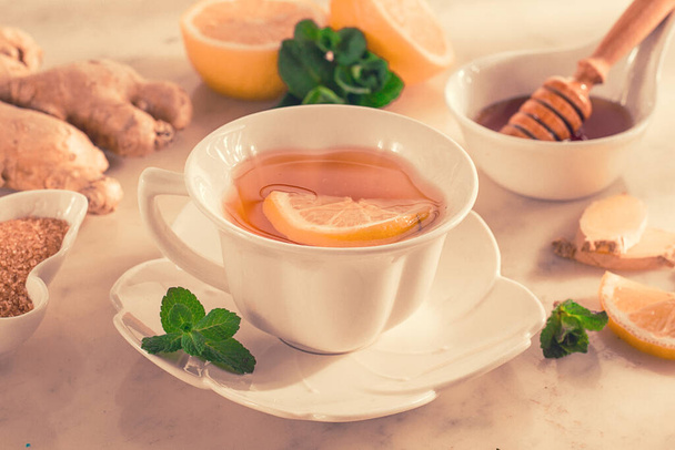 Tea with ginger, lemon and mint, selective focus, no people, sunlight, breakfast, morning, lifestyle, - Foto, Bild