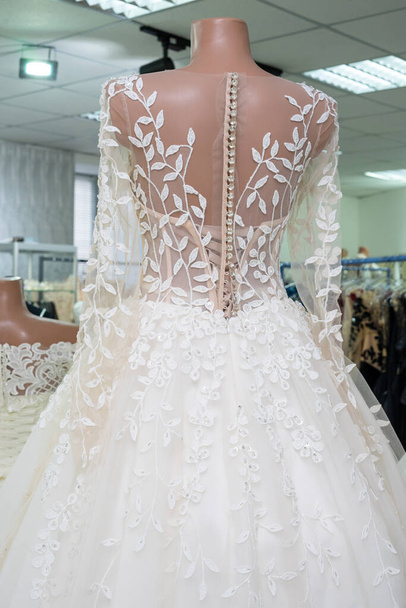 Beautiful bride's dress close-up view from behind. - Fotó, kép