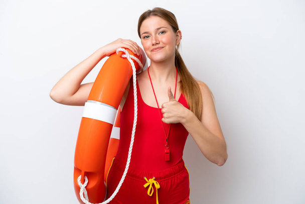 Young caucasian woman isolated on white background with lifeguard equipment and with thumbs up - Foto, immagini