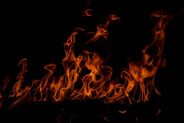 Fire flames on black background. Fire burn flame isolated, abstract texture. Flaming effect with burning fire - Zdjęcie, obraz