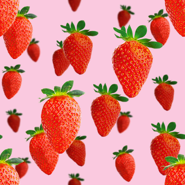 Fresh strawberry seamless pattern. Ripe strawberries isolated on pink. Package design background. Falling strawberry selective focus. - 写真・画像