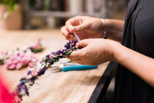 flower shop small business professional doing a fresh and romantic wedding decor - 写真・画像