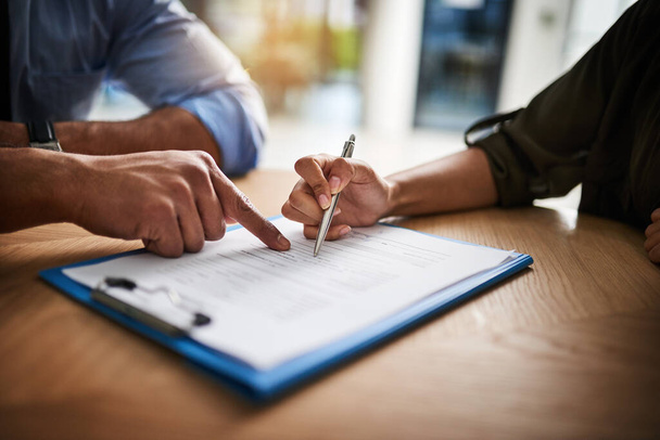Lawyer, broker or HR manager signing a contract agreement with client or employee. Financial advisor asking for womans signature for insurance, legal paperwork or claim document. - Fotografie, Obrázek