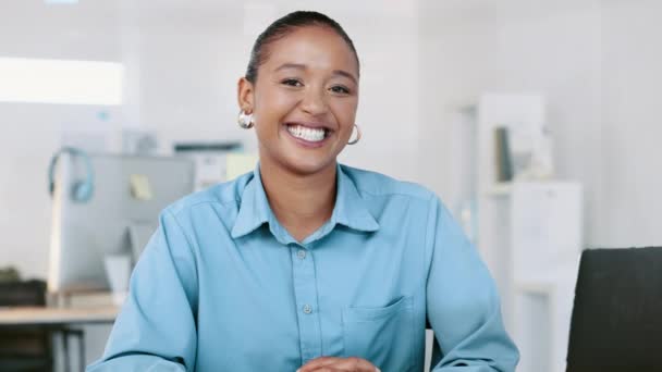 Happy, proud and confident black female lawyer laughing and sitting at a desk in a modern office. Portrait of a relaxed and a carefree African American attorney ready to help with legal advice. - Filmagem, Vídeo