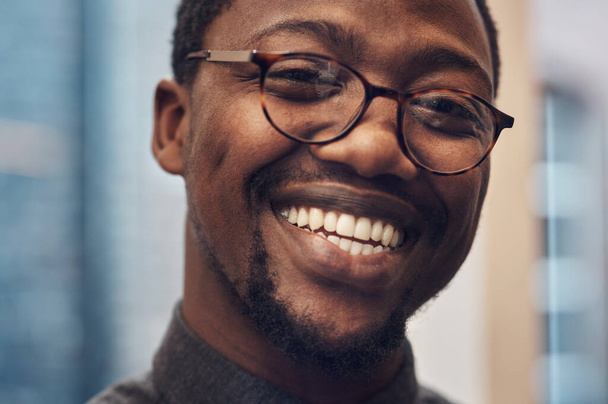 Talk about design if you wanna make me happy. Cropped portrait of a handsome young male architect smiling while standing in a modern office - Fotó, kép