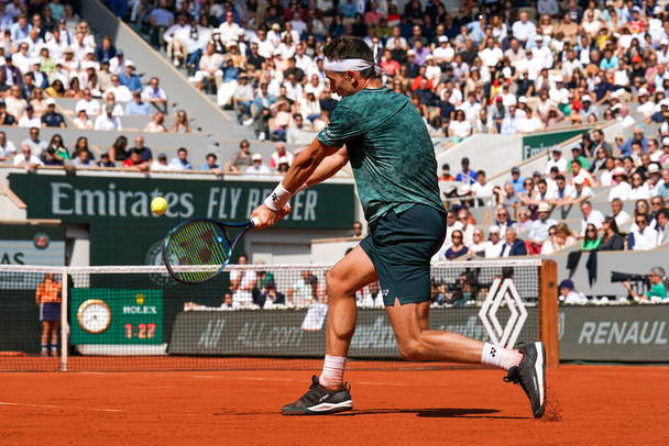PARIS, FRANCE - JUNE 5, 2022: Professional tennis player Casper Ruud of Norway in action during his men's singles final match against Rafael Nadal of Spain at 2022 Roland Garros in Paris, France - Photo, Image