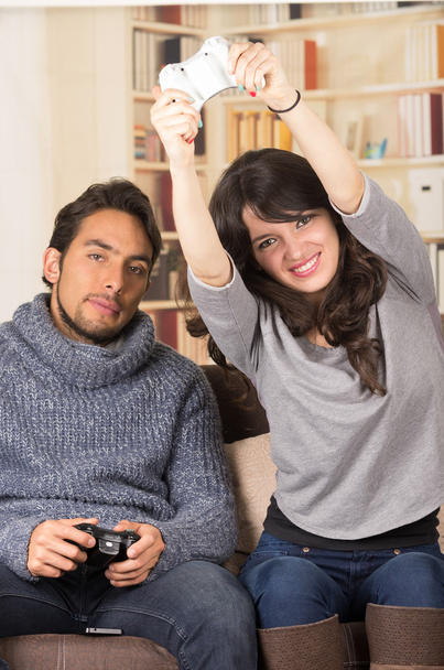Young Cute Competitive Boyfriend Girlfriend Playing Video Games In Couch  Stock Photo, Picture and Royalty Free Image. Image 34313215.