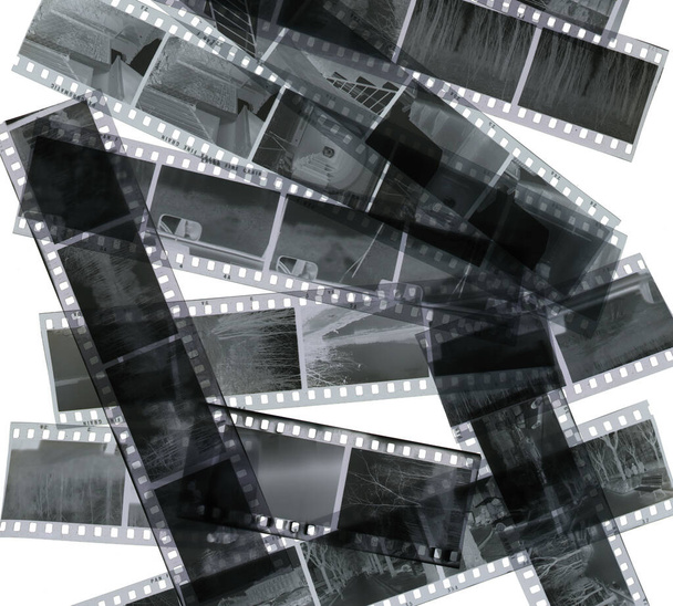 Background of old photohraphic negative films. Black and white strips. - Photo, Image