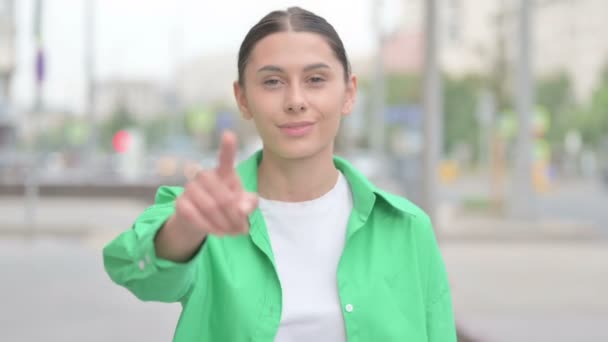 Young Woman Pointing at the Camera Outdoor - Materiał filmowy, wideo