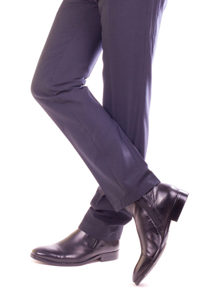 Homme d'affaires debout avec jambes croisées
 - Photo, image