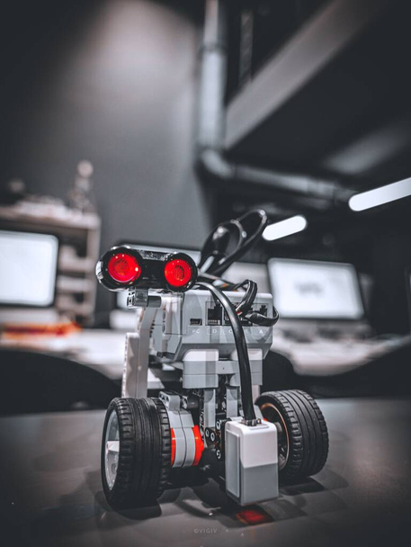 A Lego robot with wheels in the studio - Foto, Imagem