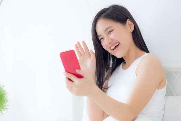 Young asian woman using smartphone for video conference online with friends, businesswoman working with video call for meeting with social network with smart phone, business and communication concept. - Foto, immagini