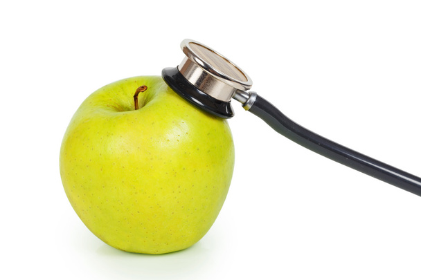 Misuratore di pressione sanguigna e mela verde
 - Foto, immagini