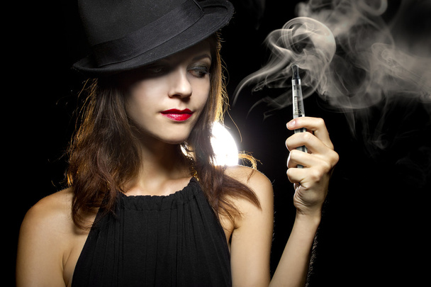 Woman vaping an electronic cigarette - Zdjęcie, obraz
