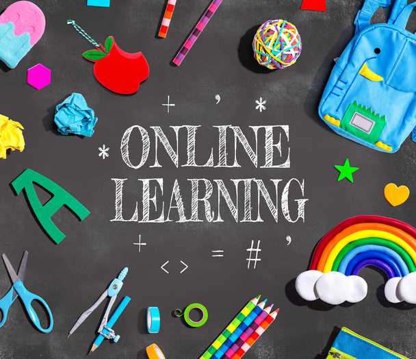 Online Learning theme with school supplies on a chalkboard - flat lay - 写真・画像