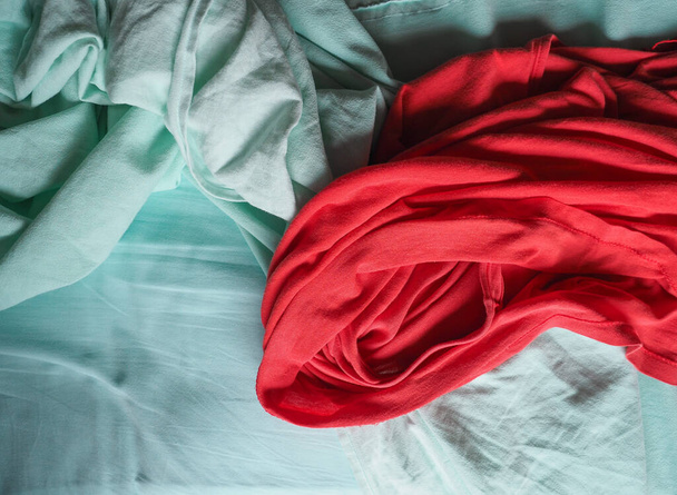 red and light green fabric texture useful as a background - 写真・画像