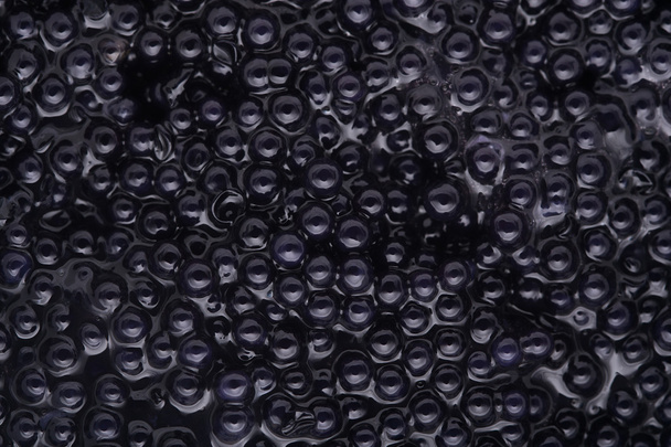 Fekete kaviár háttér, felülnézet - Fotó, kép