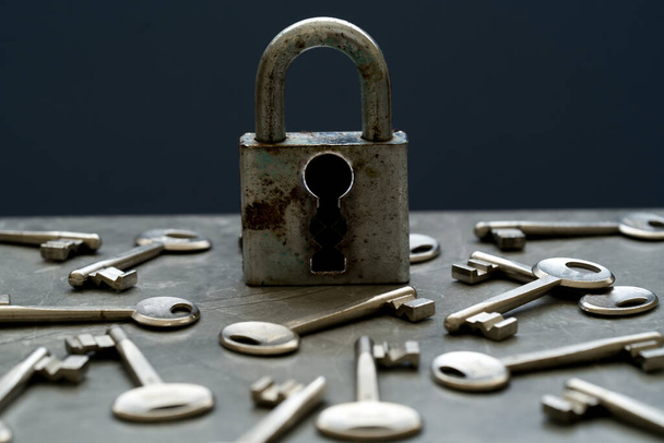 Hands holding lock and key on isolated background. Concept of solving problem and solution. - Foto, imagen