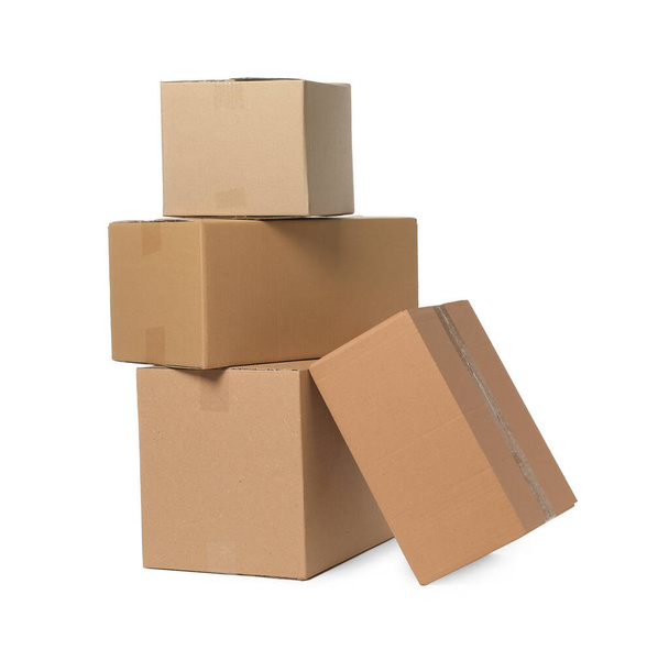 Many closed cardboard boxes on white background. Delivery service - Fotografie, Obrázek