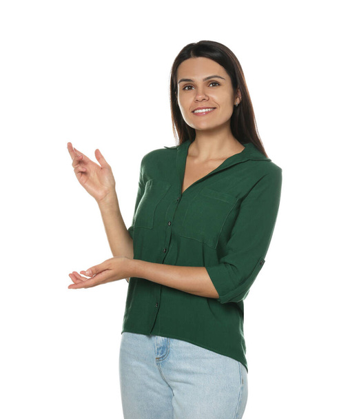 Beautiful young woman gesturing on white background. Weather forecast reporter - Zdjęcie, obraz