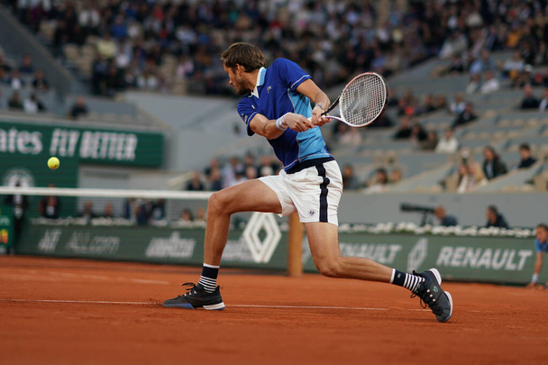 PARIS, FRANCE - MAY 30, 2022: Grand Slam Champion Daniil Medvedev of Russia  in action during his men's singles round 4 match against Marin Cilic of Croatia at 2022 Roland Garros in Paris, France - 写真・画像