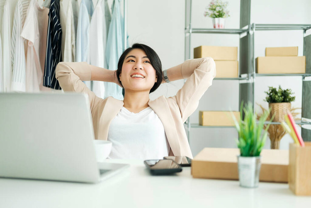 Happy young asian female freelan sit in online clothing store.Work at home concept. work from home. - Foto, Imagem