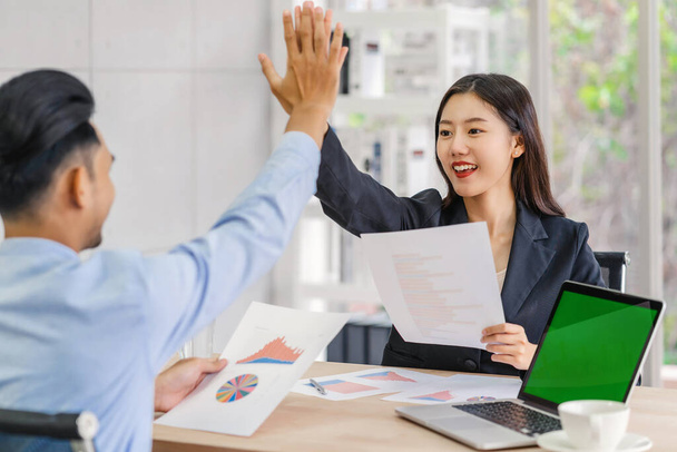 Boss congratulating by give me five action to asian businesswoman in glad action when successful project or getting promote, rewarding the business target in modern office, Success business concept,  - Foto, imagen