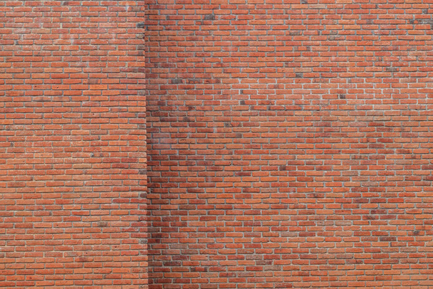 The brick wall background was made to show off the brick lines and the beautiful orange color of the bricks. Rainy day orange wall background with Copy Space for design and advertising text. - Фото, изображение